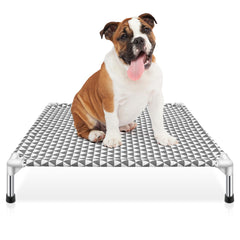 Kuntrust elevated outdoor dog bed in outdoor scene provides cooling comfort for dogs.