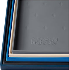 Leash Boss raised-edge silicone dog food mat prevents spills during meals.