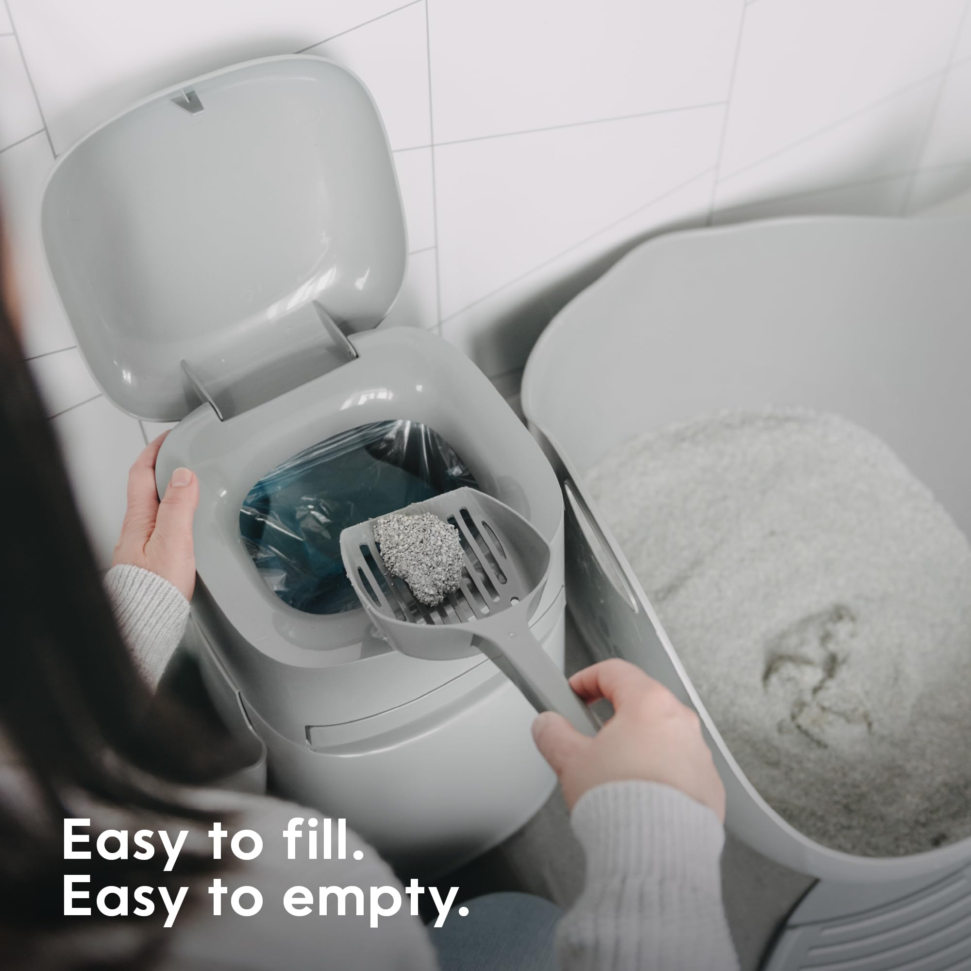Litter Genie scoop and holder keeps scooping tidy.