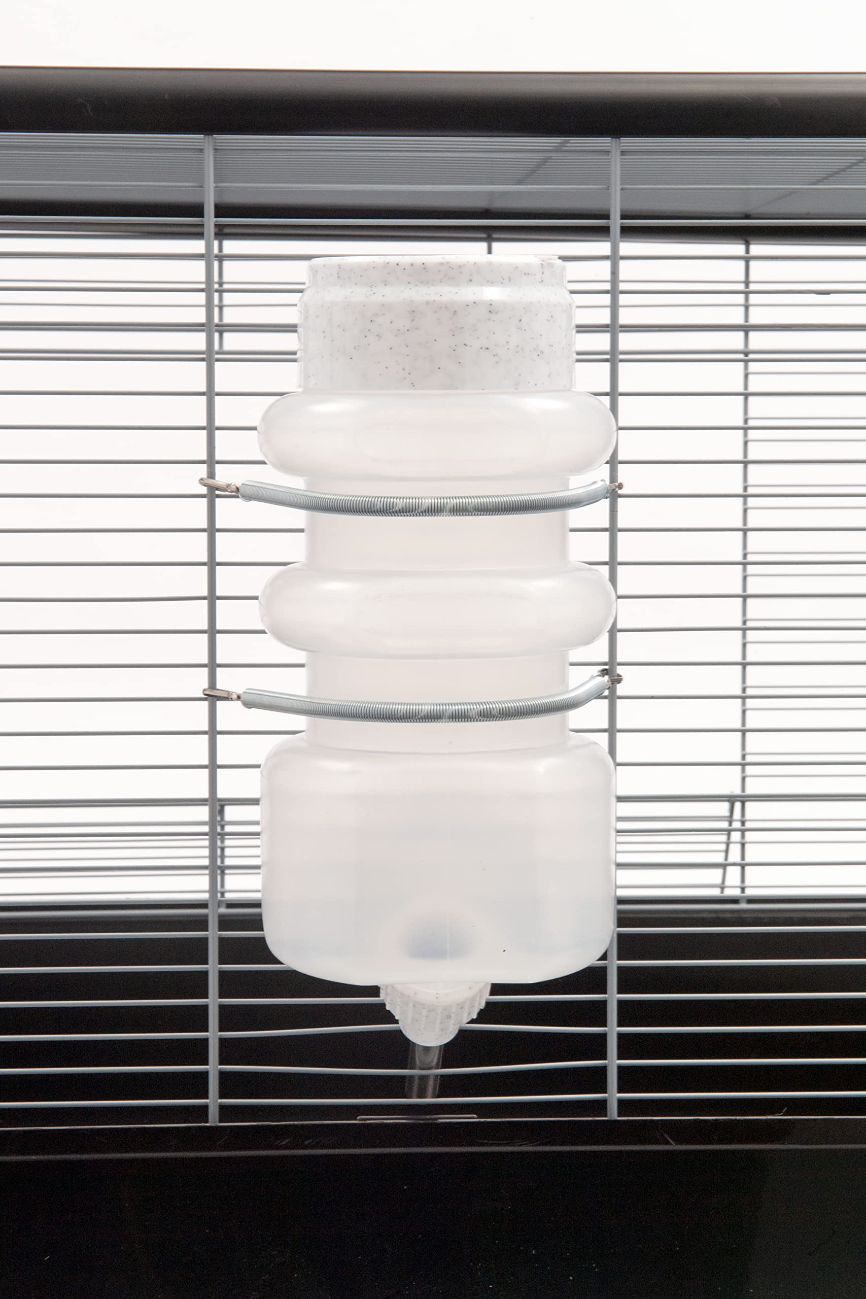 Heavy-duty spring clamp securing the Lixit bottle in place.