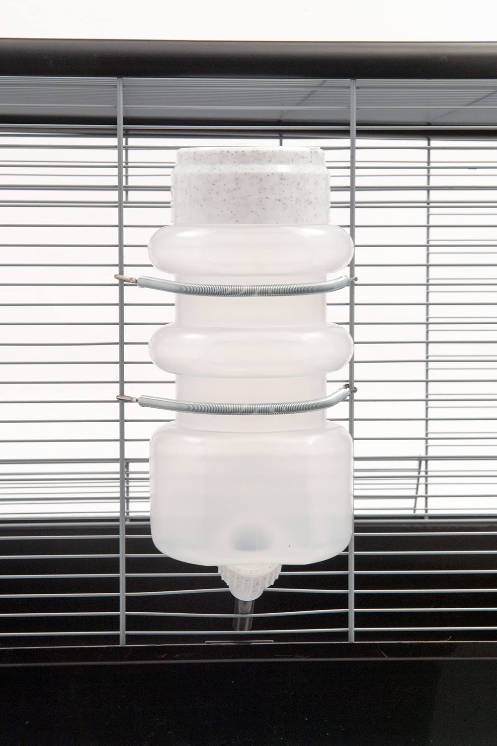 Heavy-duty spring clamp securing the Lixit bottle in place.