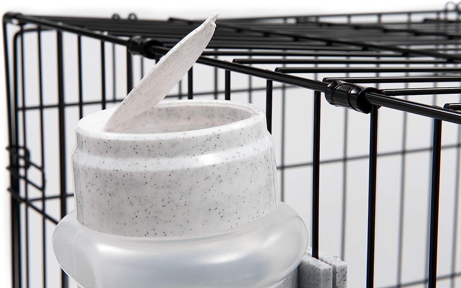 Lixit Top Fill No-Drip Bottle, 44-ounce capacity, mounted in crate during travel.