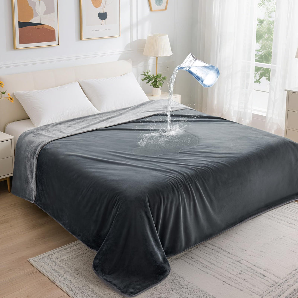 LOOBANI waterproof blanket on a queen bed protects surfaces from spills and stains.