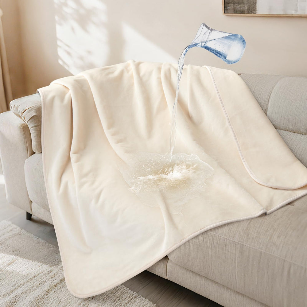 LOOBANI waterproof dog blanket on a sofa protecting upholstery and pets