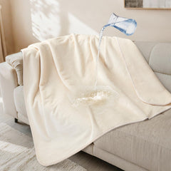 LOOBANI waterproof dog blanket on a sofa protecting upholstery and pets