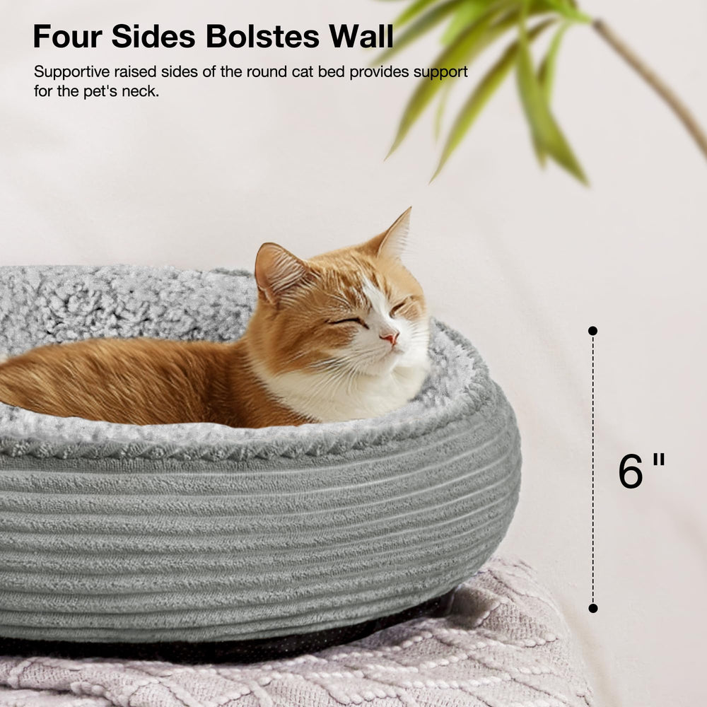 Love's cabin round donut bed in home scene showing calm, curled pets