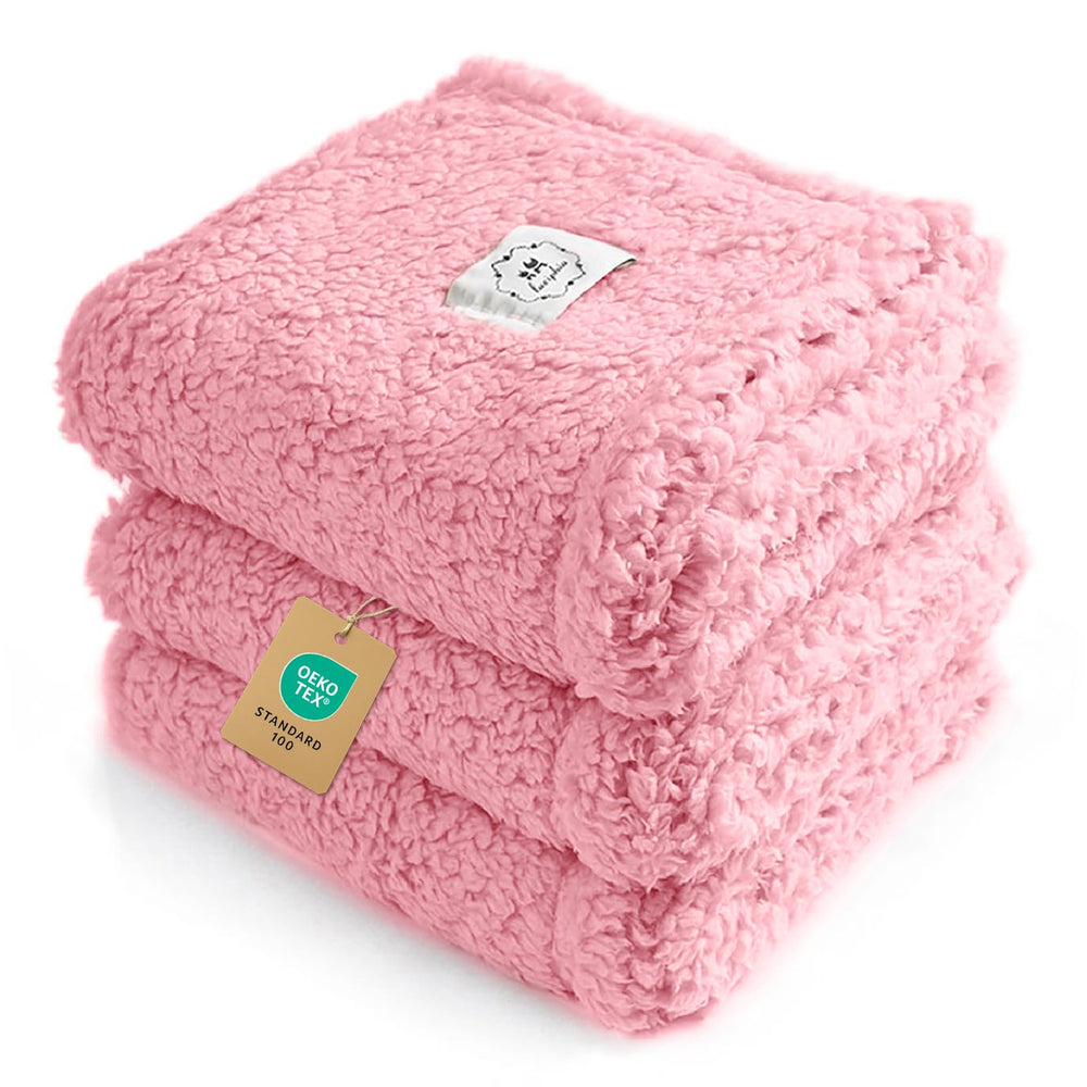 Luciphia calming dog blanket in pink with soft sherpa for cozy naps.