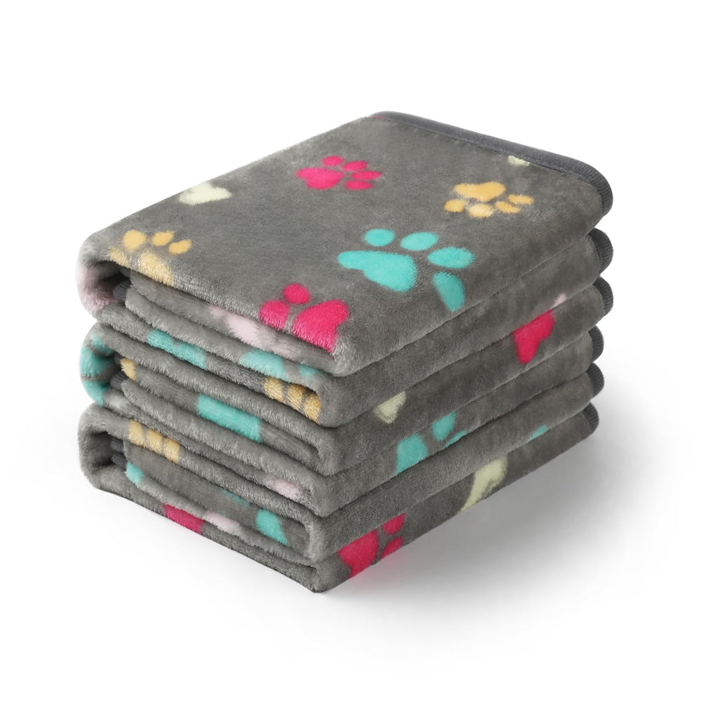 Luciphia paw-printed large grey throw on sofa showing pet-friendly protection and style