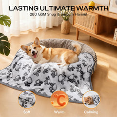 Luciphia pet blanket on sofa with paw design ideal for lounging.