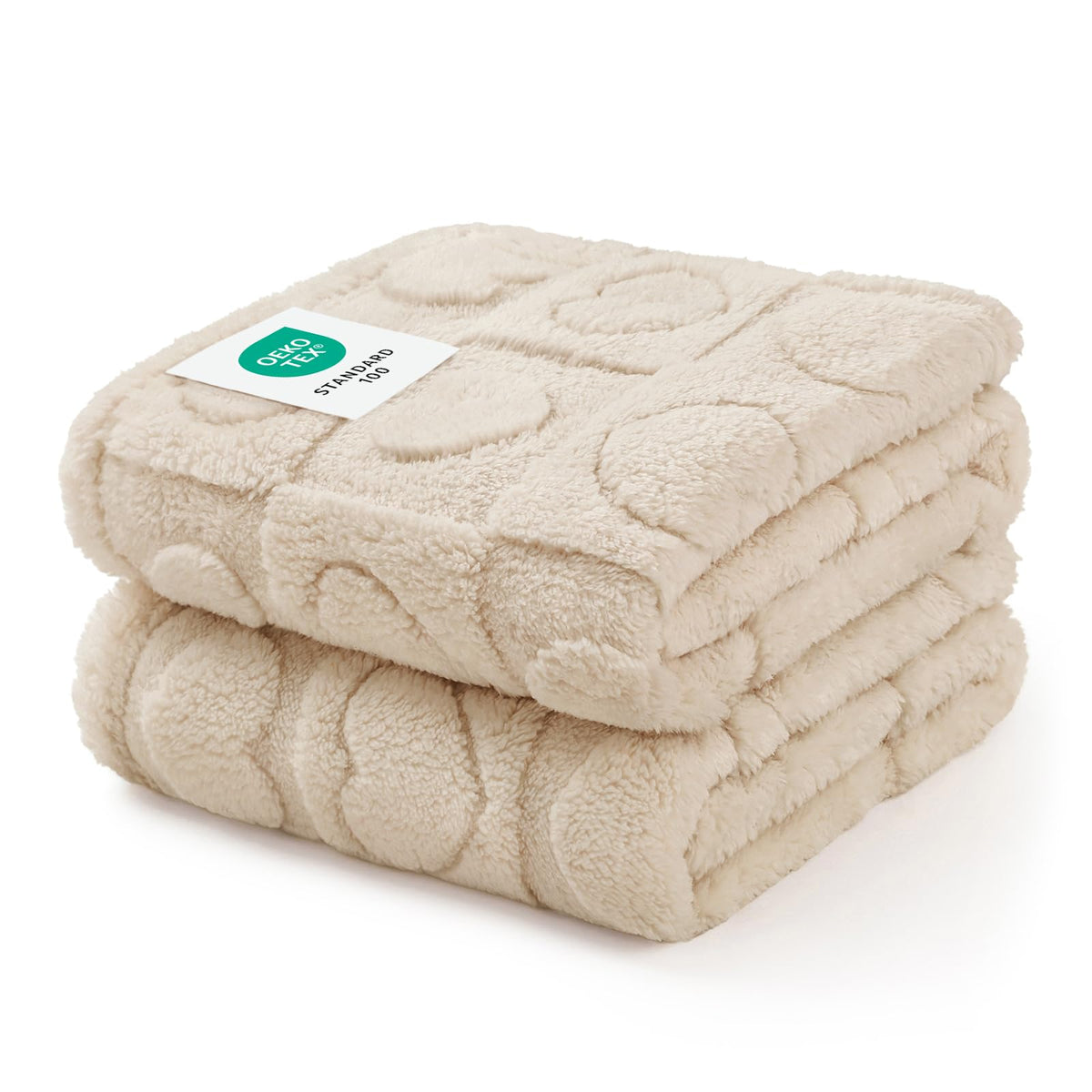 Luciphia small dog blanket on sofa protecting furniture with plush beige fleece.