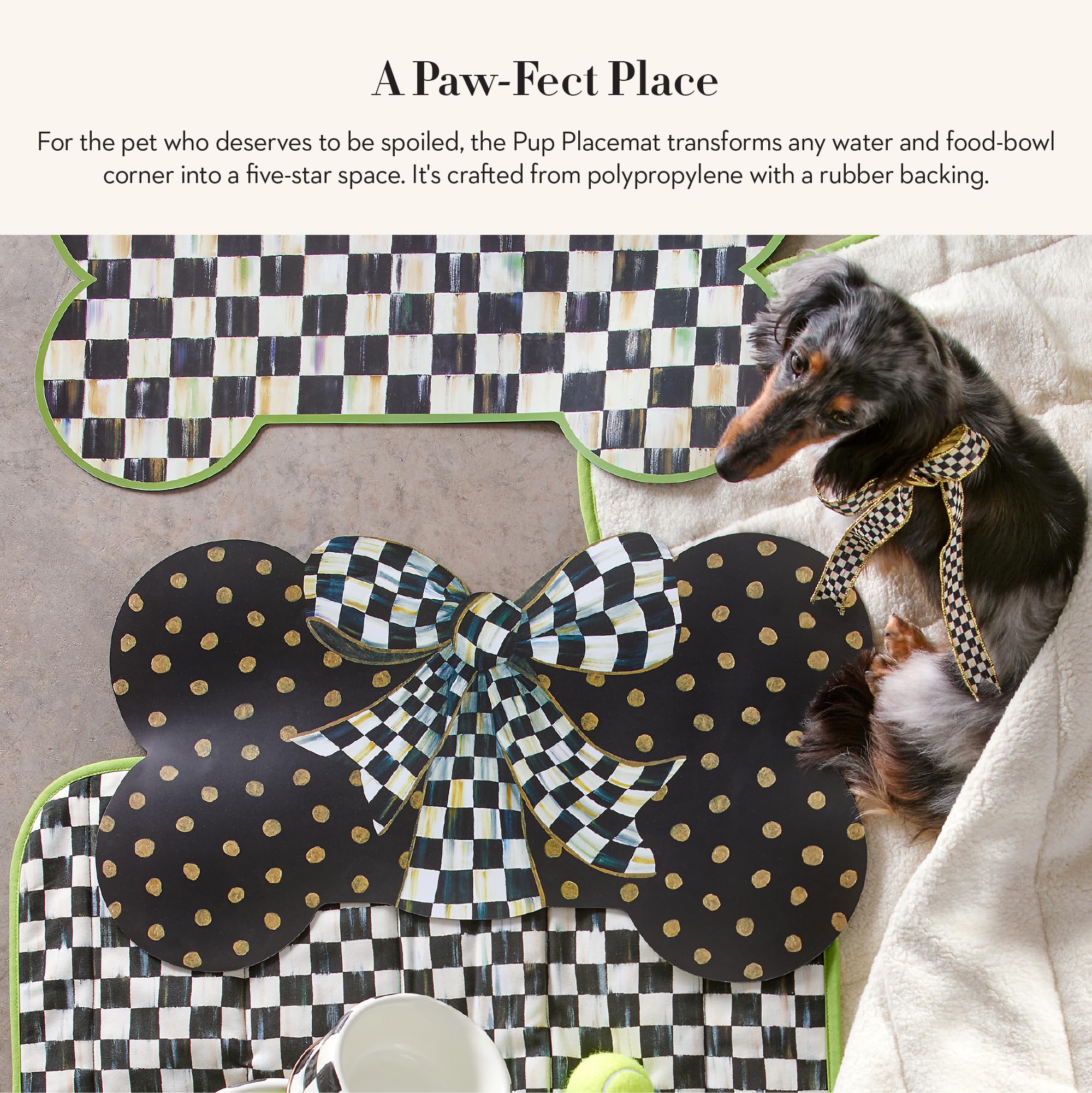 Mackenzie-Childs Courtly Bow pet mat with gold dots enhances dining areas
