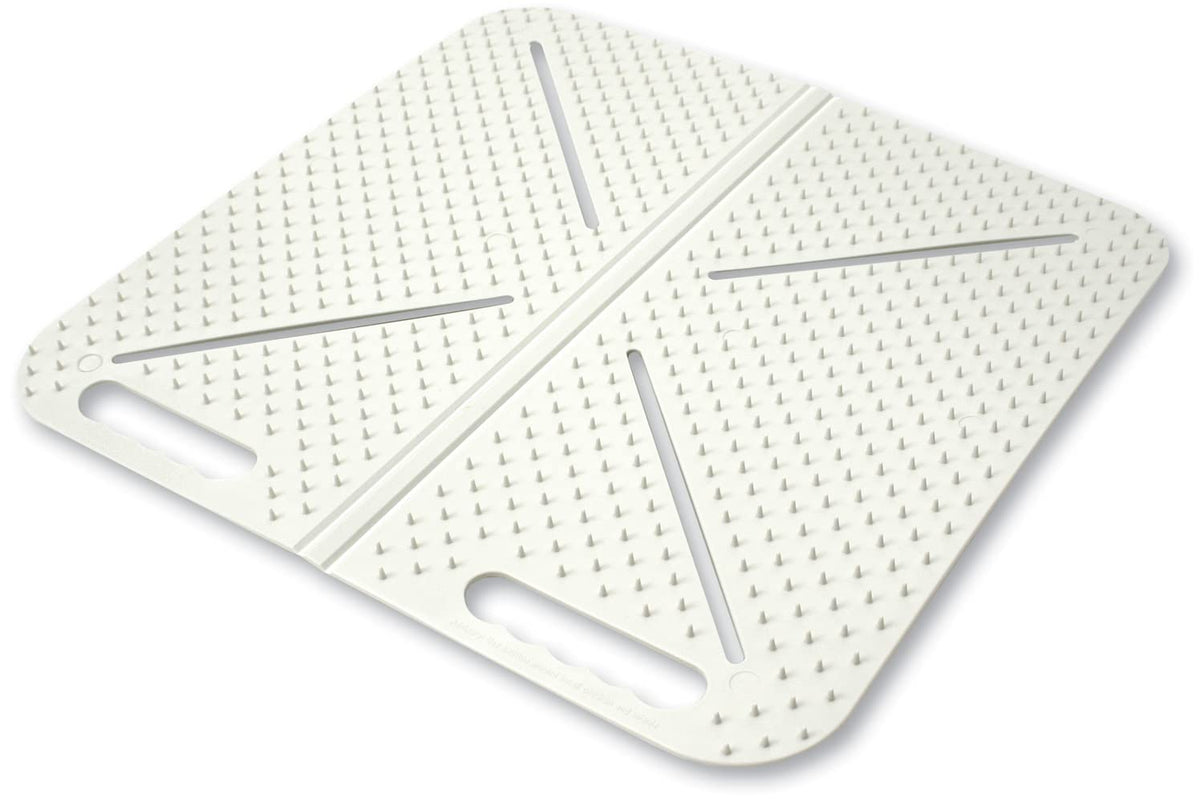 Mammoth X-Mat Foldable Training Mat in beige keeps pets off furniture.