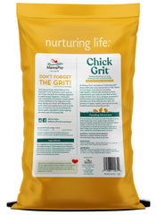 Manna Pro Chick Grit Probiotics scoop demonstrating easy portioning for daily feeding.