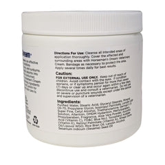 Manna Pro Corona Horsemans Dream hands applying cream on horse skin for calm, moisturized healing.