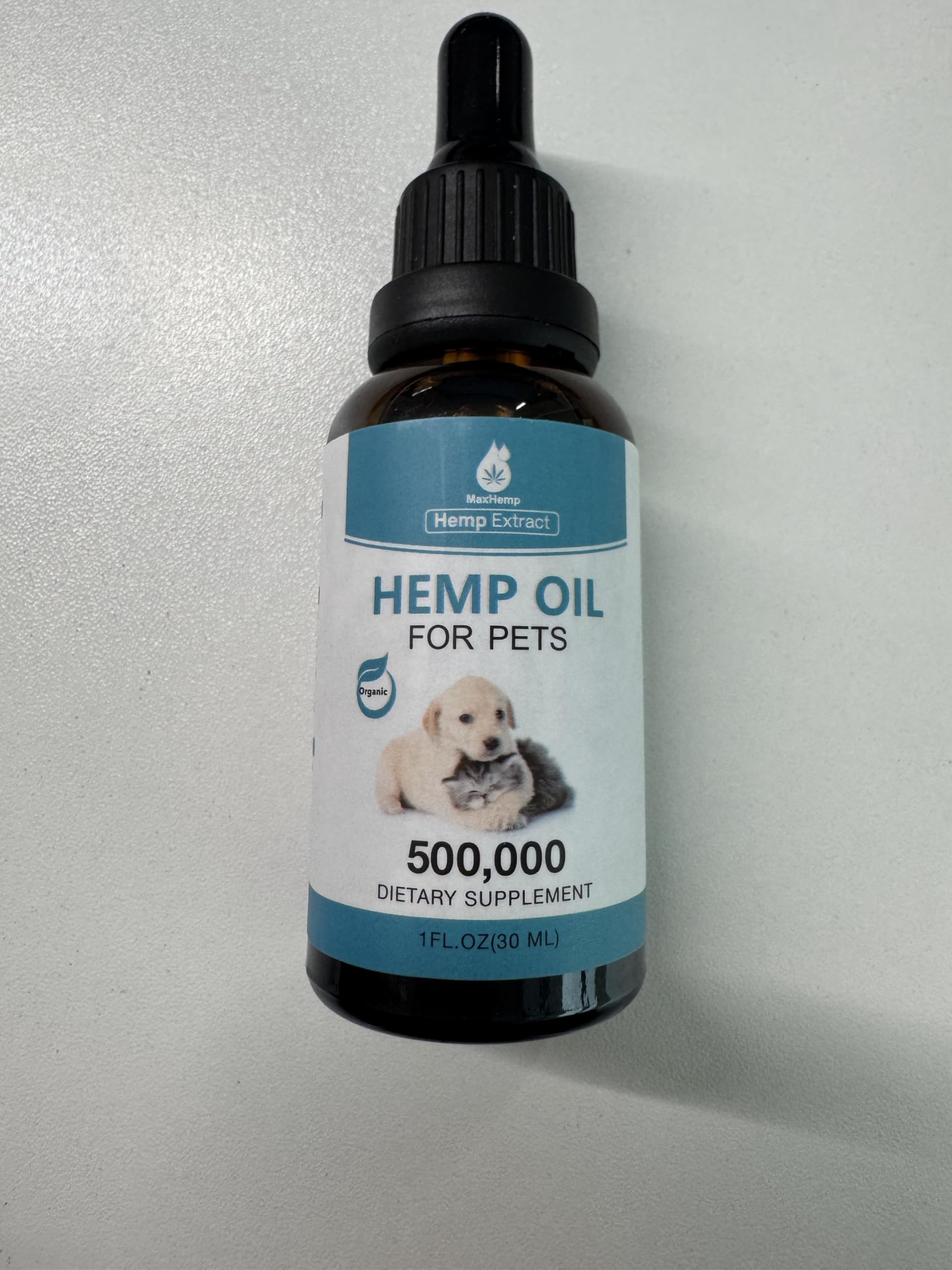 MaxHemp pet oil drops with measuring scoop highlights precise portion control.