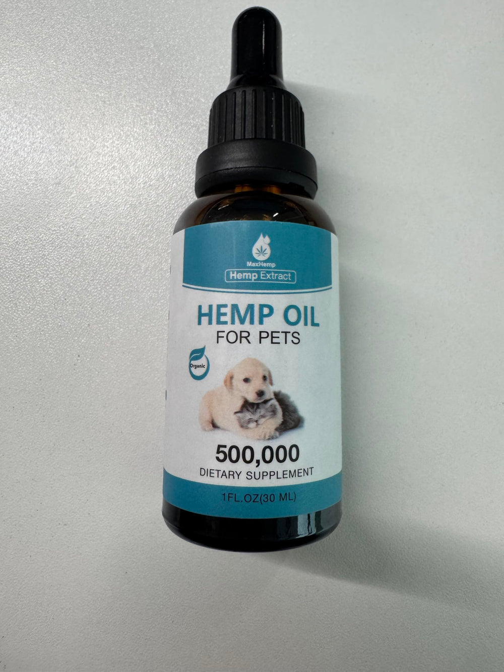 MaxHemp pet oil drops with measuring scoop highlights precise portion control.