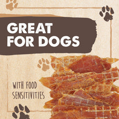 Dog chewing Mighty Paw Naturals chicken jerky, satisfying chew