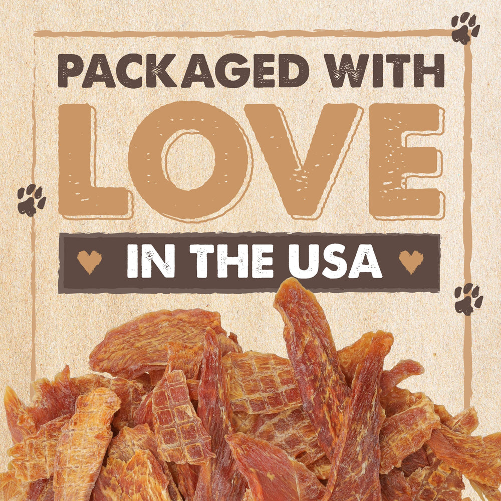 Chips of Mighty Paw Naturals jerky slices on a cutting board, tasty reward