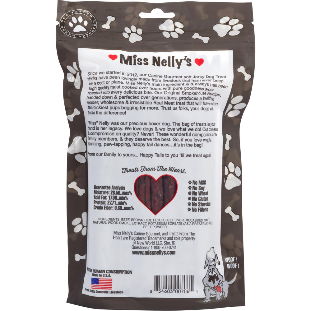 A dog happily chews Miss Nelly's jerky during training session.
