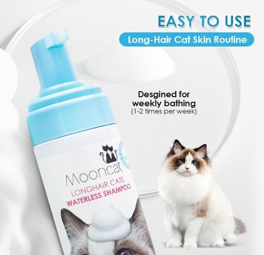 Long-haired cat enjoys grooming with Mooncat care routine.