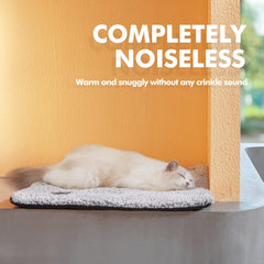 Mora Pets self warming cat bed indoors during a cozy nap