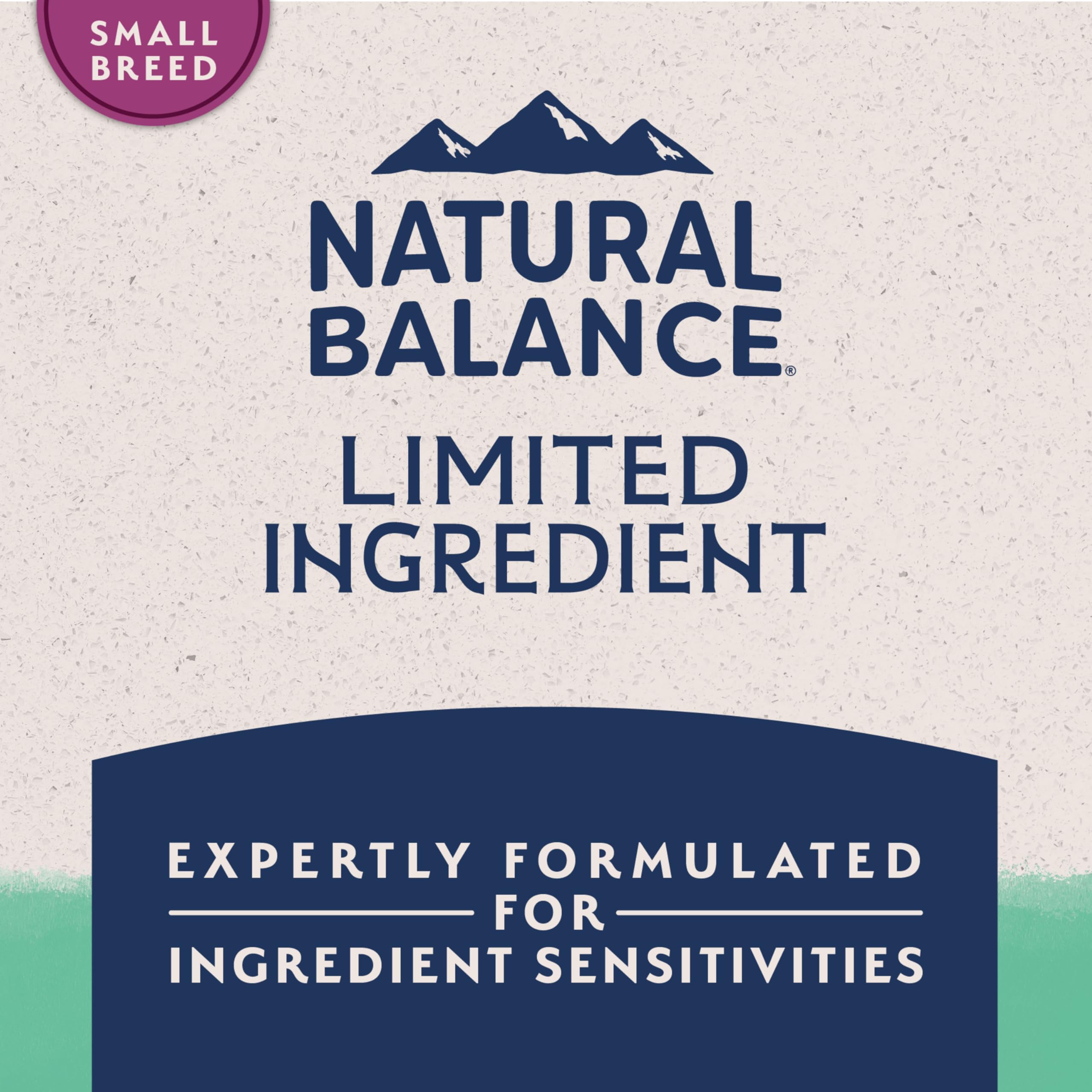Natural Balance L.I.D. small breed dog sniffing kibble, inviting tasting.