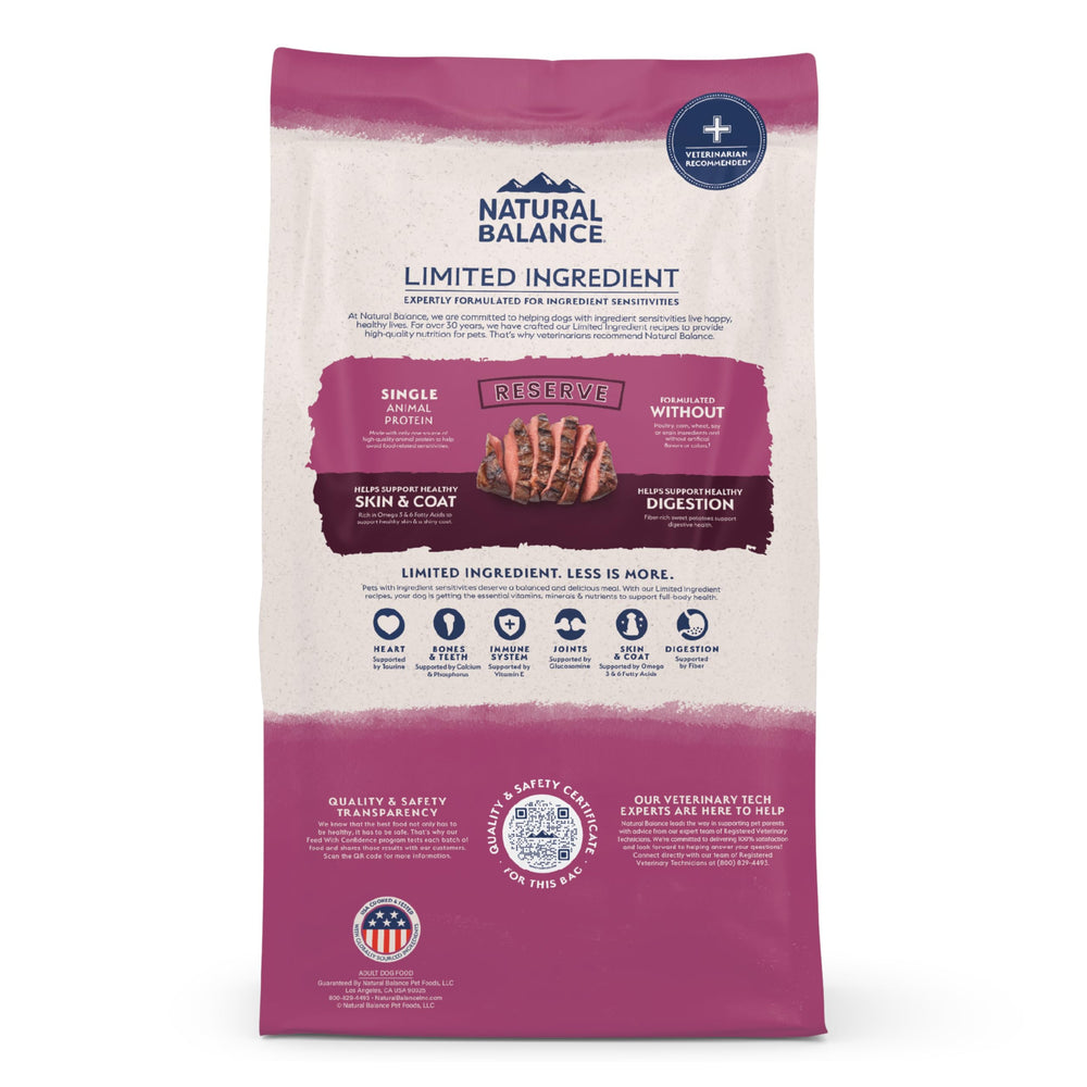 Dog enjoying a meal of Natural Balance Reserve venison sweet potato dry food