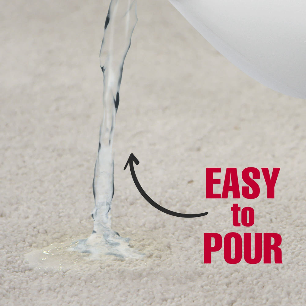 Nature's Miracle Urine Destroyer Plus application — spray-on application on carpet for quick action.
