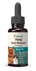 NaturVet Hemp Quiet Moments drops being applied to a dog's mouth via dropper