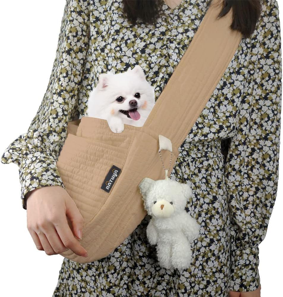 NATUYA small dog carrier sling in brown on model side view shows hands-free convenience.