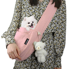 NATUYA small dog carrier sling in pink with adjustable strap for hands-free walks.