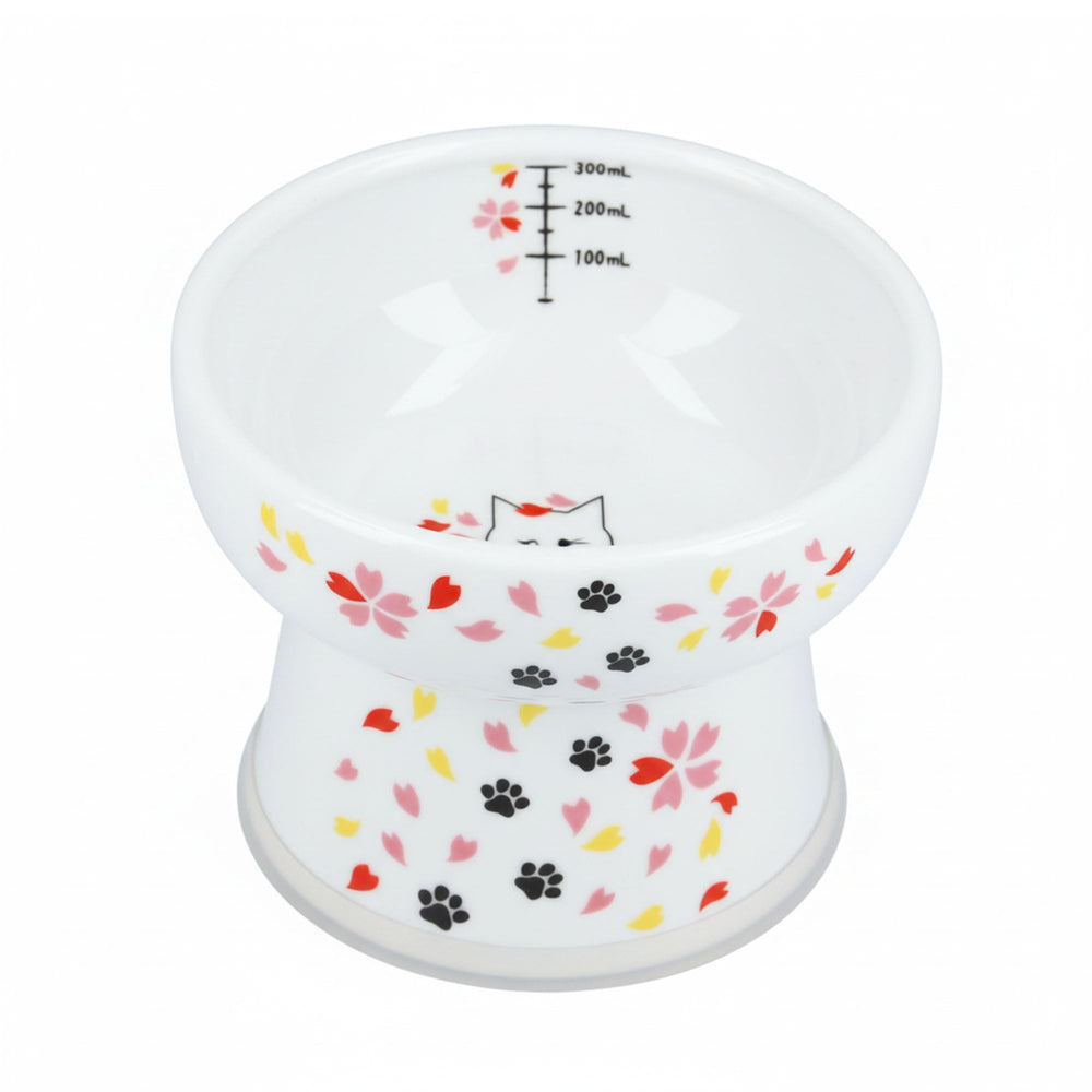 Necoichi elevated ceramic cat water bowl shown with Sakura floral design for comfortable drinking.