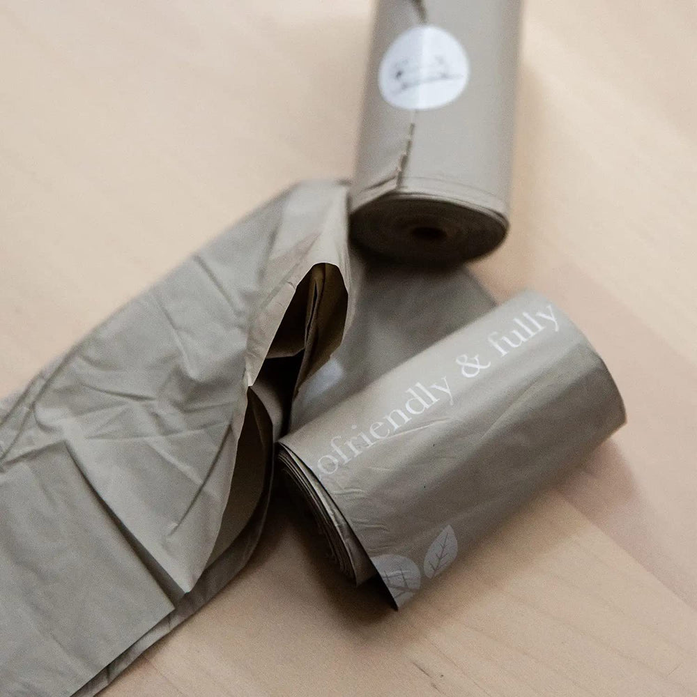 Nina Woof eco-friendly bags support responsible pet waste management on trails.