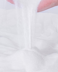 Niteangel white desert sand texture close-up showing soft grains for gentle grooming