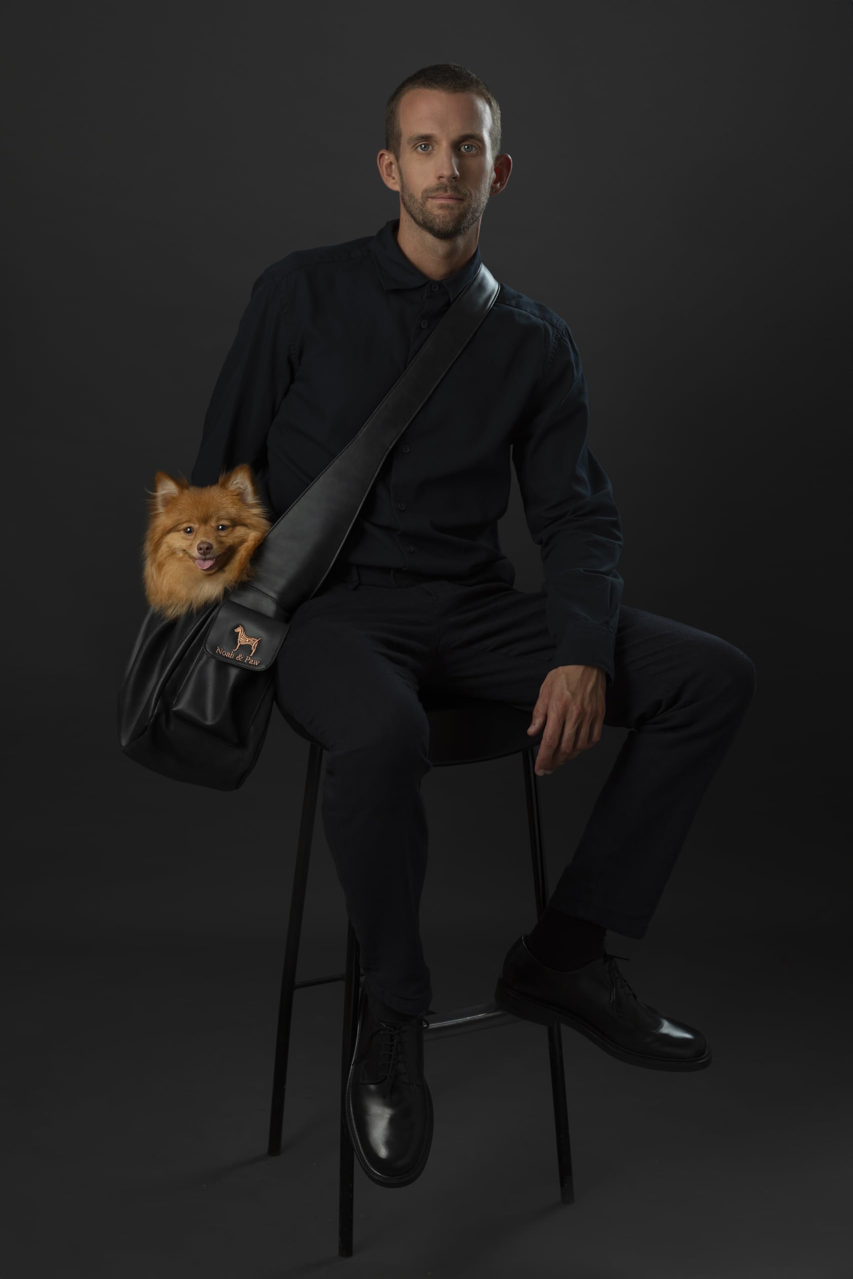 NOAH AND PAW dog sling shows adjustable shoulder strap for a customizable, comfortable fit.