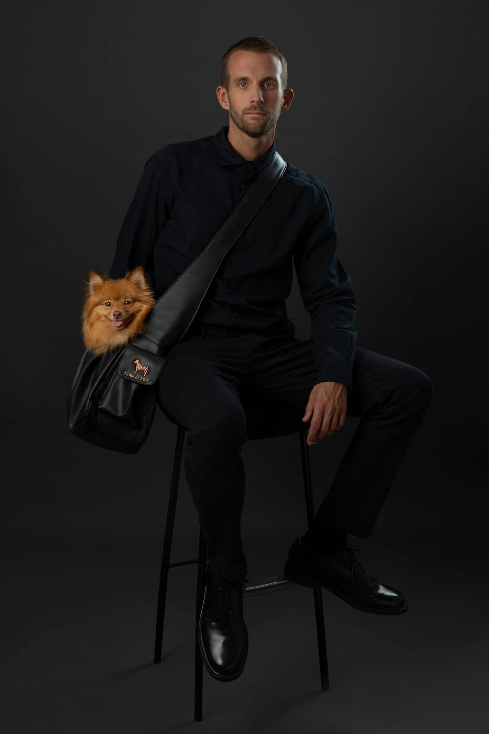 NOAH AND PAW dog sling shows adjustable shoulder strap for a customizable, comfortable fit.