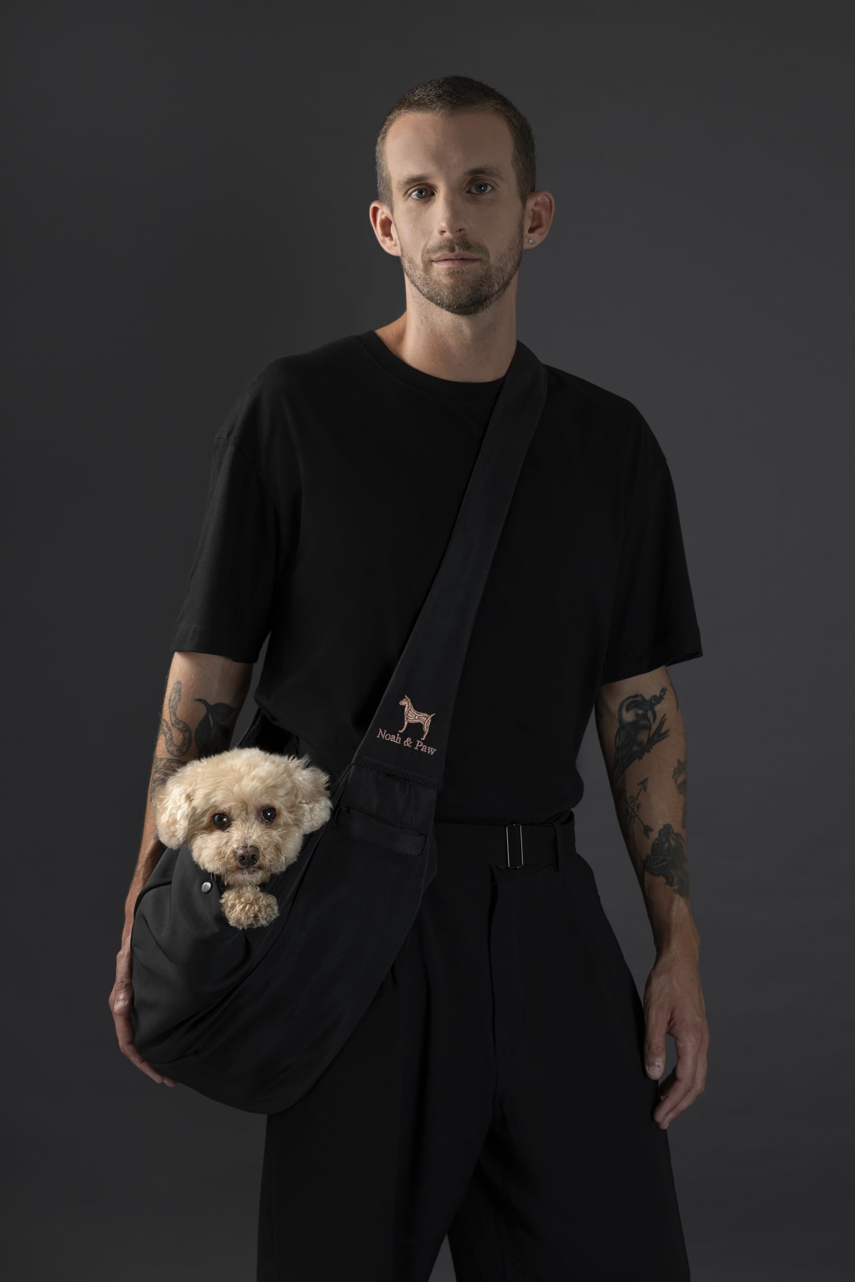 Noah & Paw dog sling with adjustable strap supports comfortable, customizable fits.