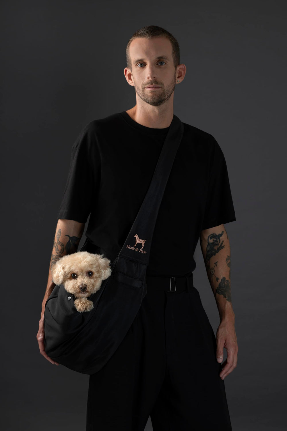 Noah & Paw dog sling with adjustable strap supports comfortable, customizable fits.