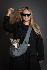 Noah & Paw sling with adjustable strap for comfortable fit.