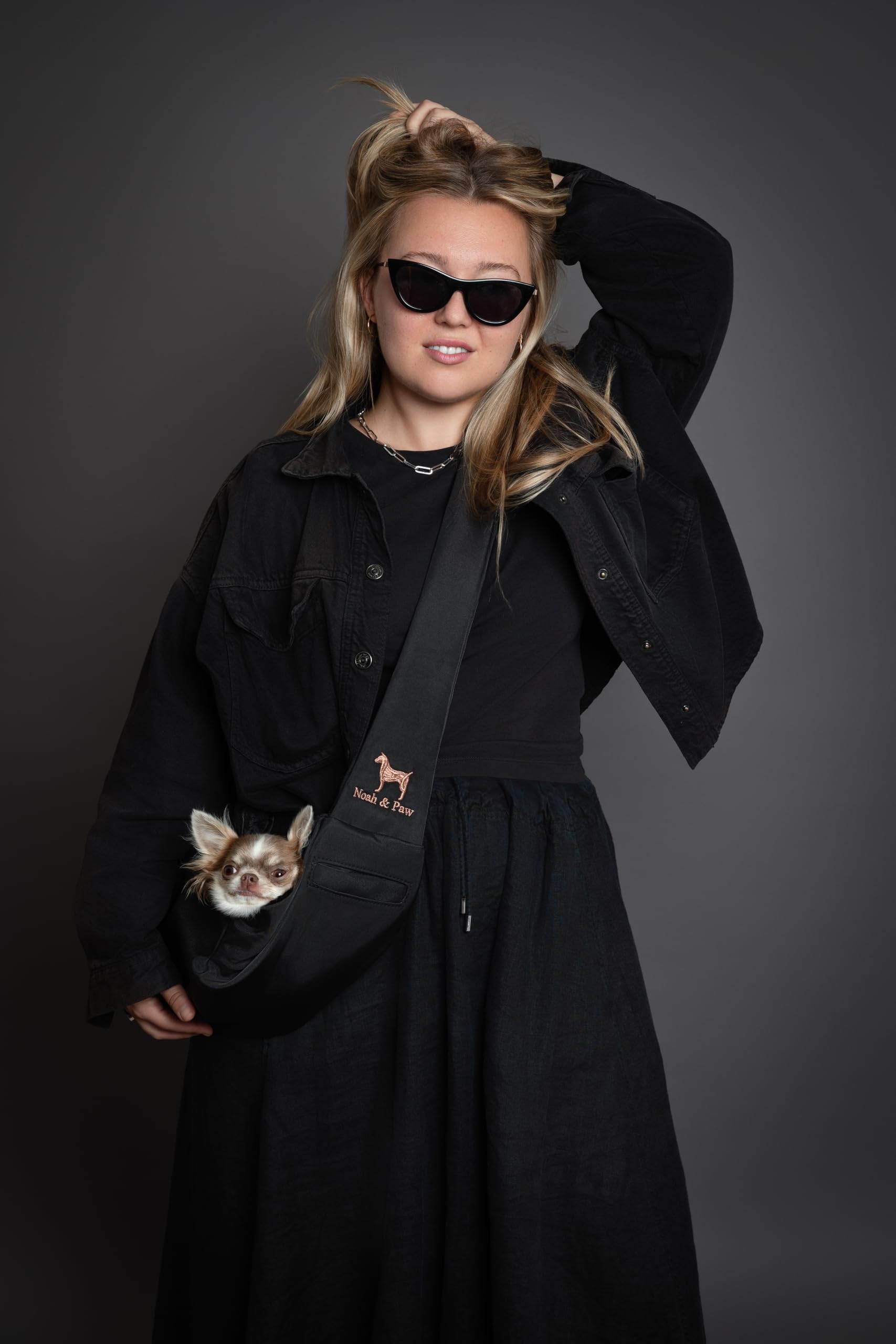 NOAH & PAW Sling used during outdoor walks for convenient carrying