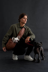Noah & Paw sling highlights safety belt and clip for extra security.