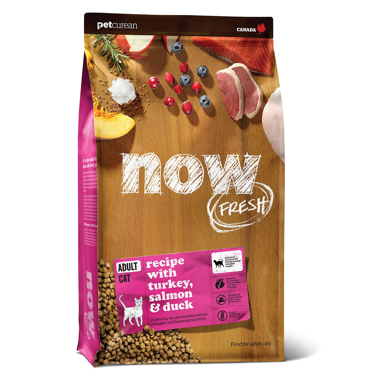 Now Fresh adult cat food kibble in a bowl with turkey, salmon, and duck for balanced nutrition.