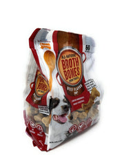 Nylabone Beef Broth Bones dog chewing close up showing savory flavor to satisfy appetites