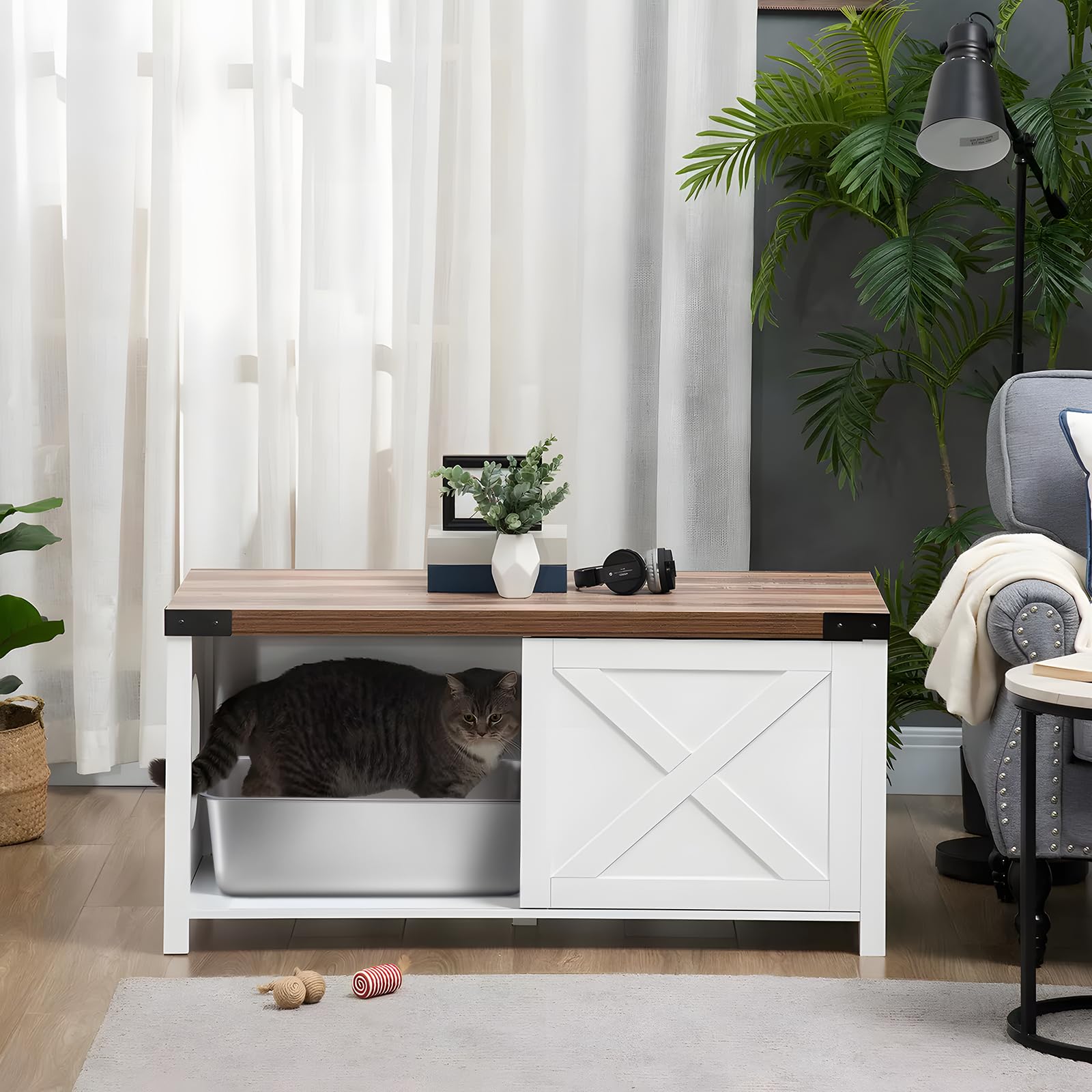 Nyutu litter box inside an enclosure demonstrates versatile placement options.