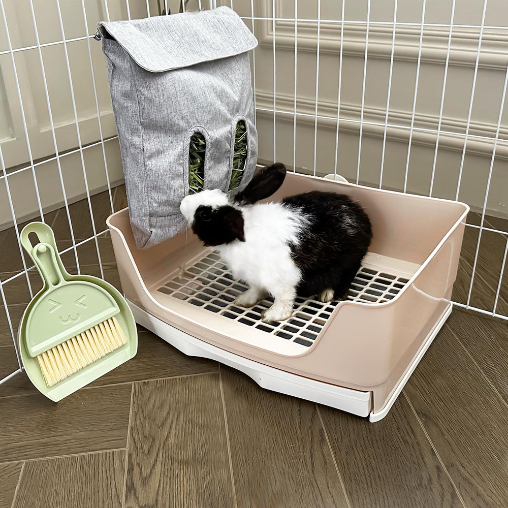 Oleisert bunny litter box with removable tray simplifies cleaning and pee pad replacement.
