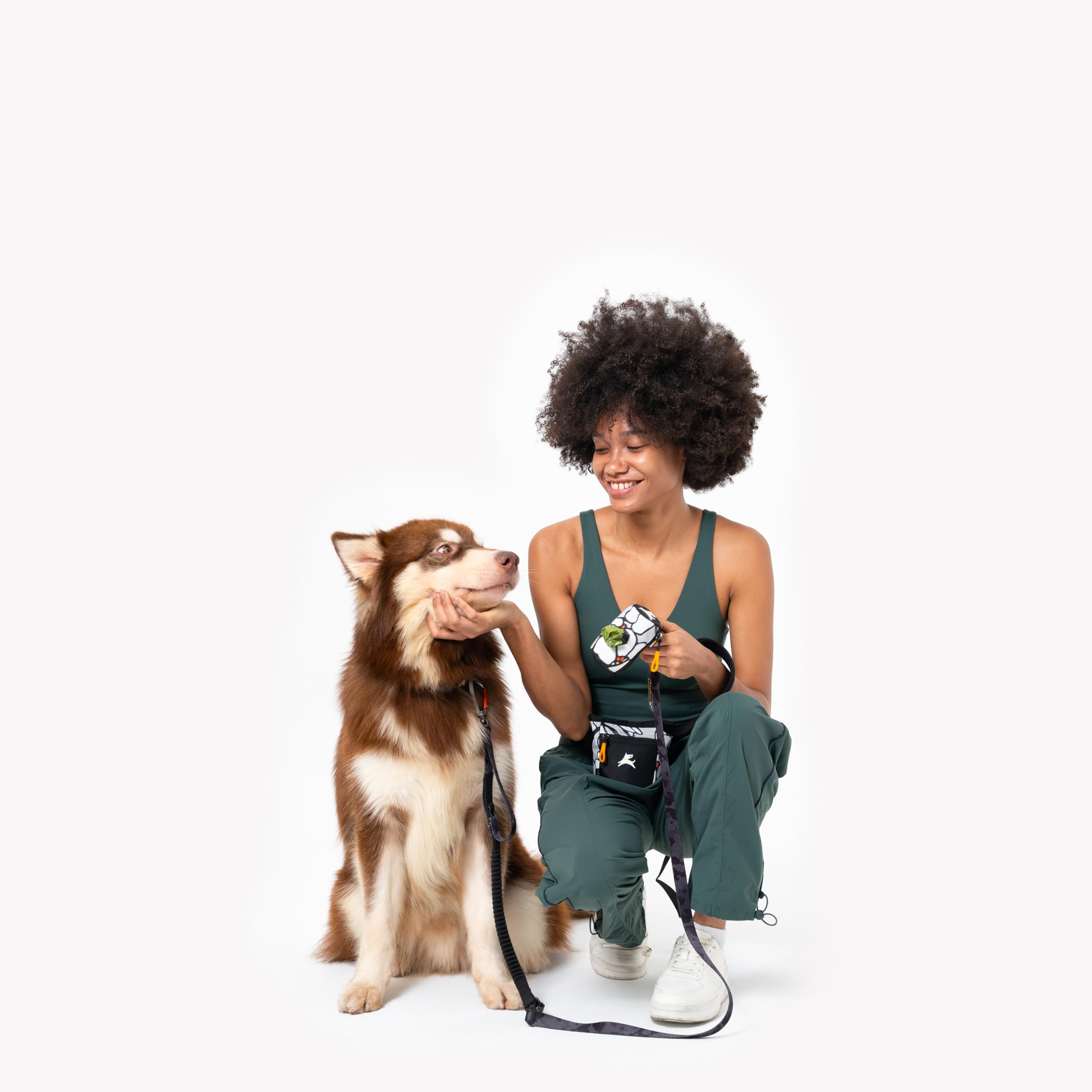 OllyDog Goodie Bag on waist belt clip for secure attachment during outdoor walks.
