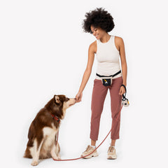 Water-resistant vegan fabric of OllyDog Goodie Treat Bag outdoors.