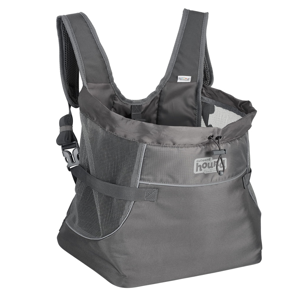 Outward Hound PupPak front carrier worn by a person, secure for small dogs.