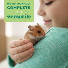 Oxbow Critical Care Omnivore hand-feeding setup showing caregiver assistance.