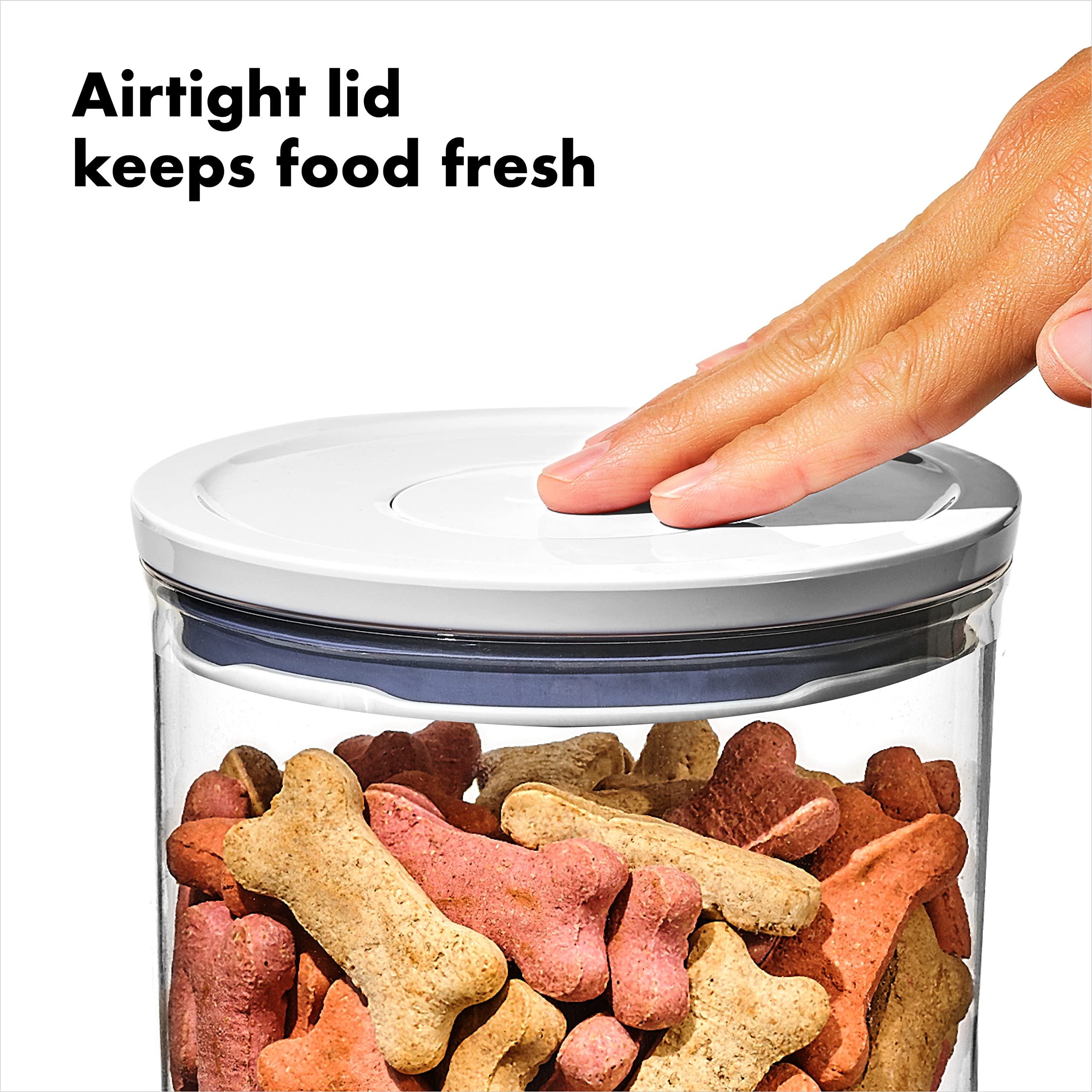 Button operation on OXO Pet POP for quick open and secure seal.